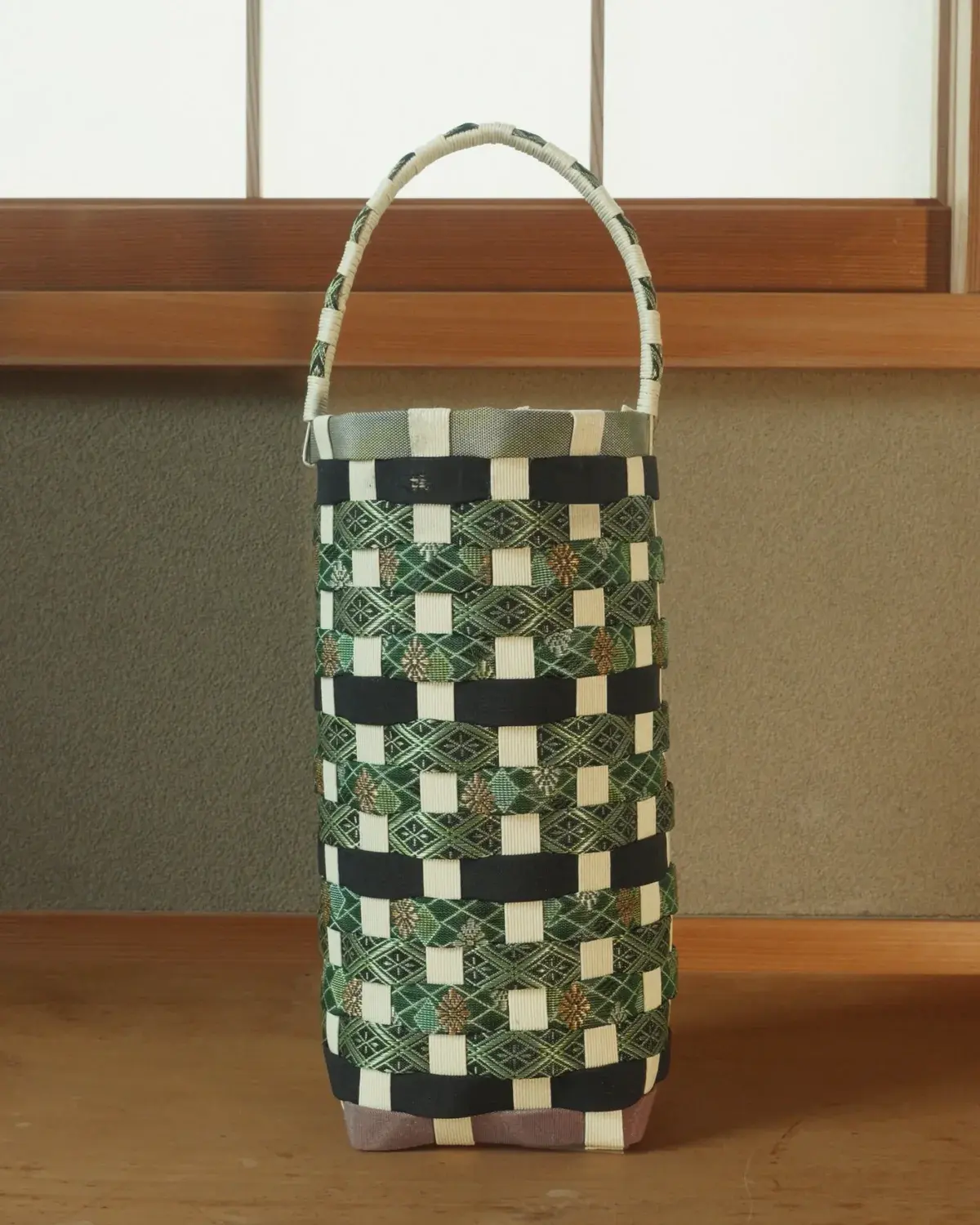 Tokiwa — Evergreen and cream in a close check, under a pale woven handle.